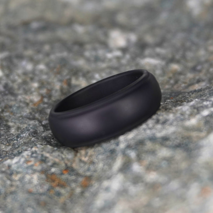 Black 8mm bevelled silicone wedding band shown from the side