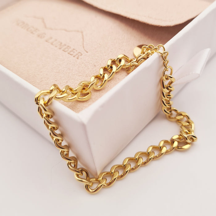 Chunky 18K gold-plated chain bracelet from Forge and Lumber, adjustable and waterproof, tarnish-free design.