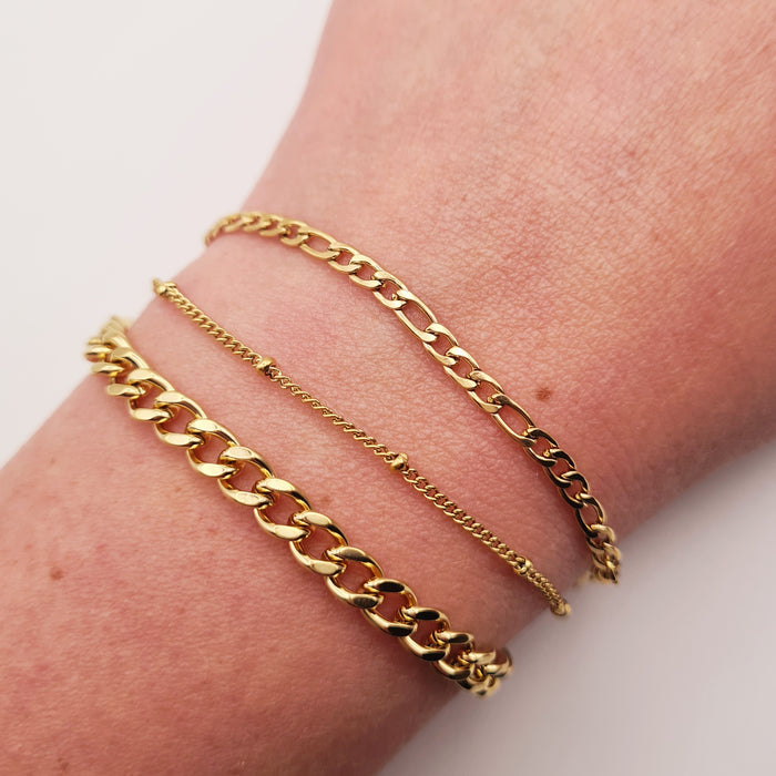 Chunky gold bracelet, 18K plated, adjustable, waterproof, tarnish-free, worn on wrist.