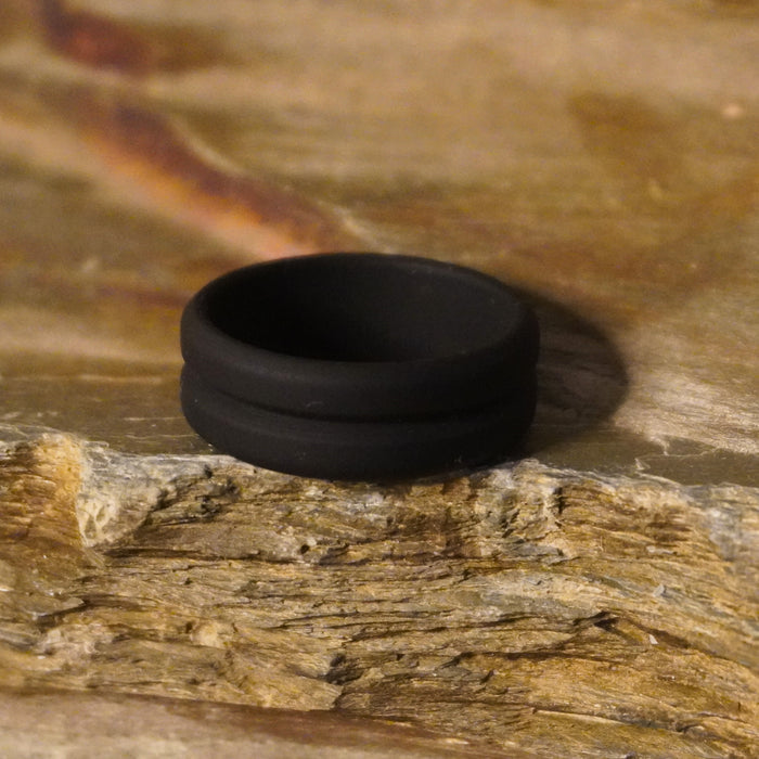 Forge and Lumber black silicone wedding band, 8mm groove design, suitable for active lifestyles.