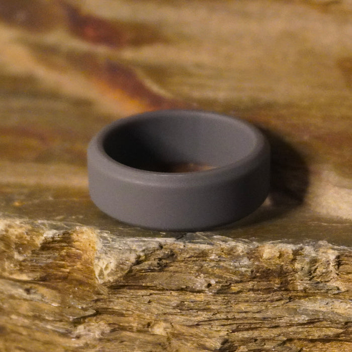Dark grey 8mm bevelled silicone ring shown at an angle