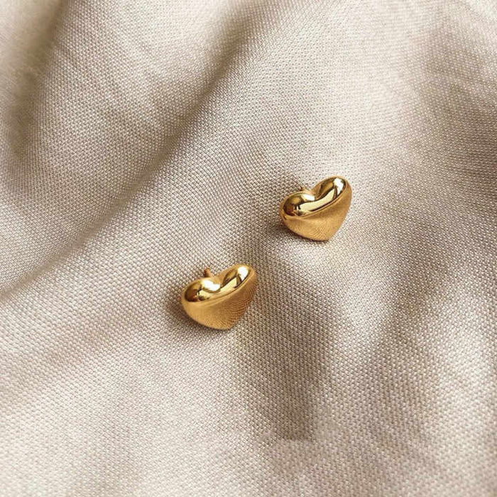 18K gold plated heart stud earrings in stainless steel by Forge and Lumber, perfect for daily wear.