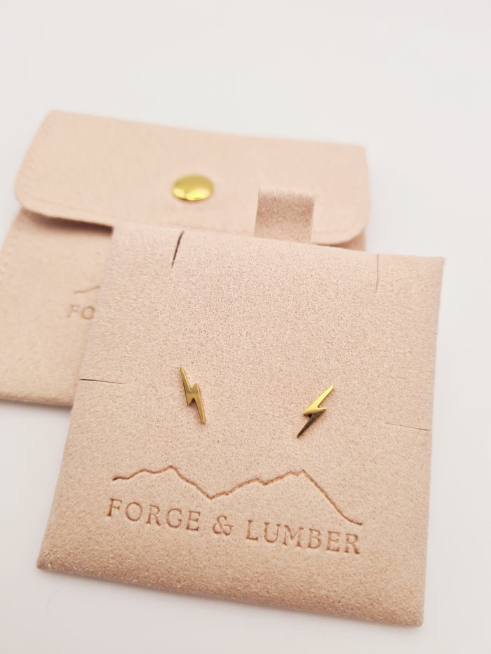 18K gold plated lightning bolt stud earrings by Forge and Lumber, geometric design in stainless steel.