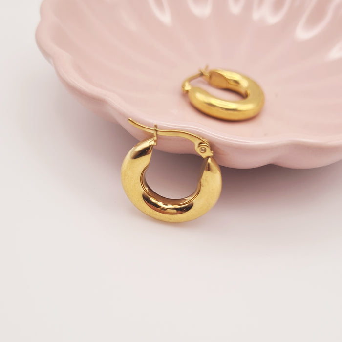 Small chubby hoop earrings in 18K gold-plated stainless steel by Forge and Lumber.