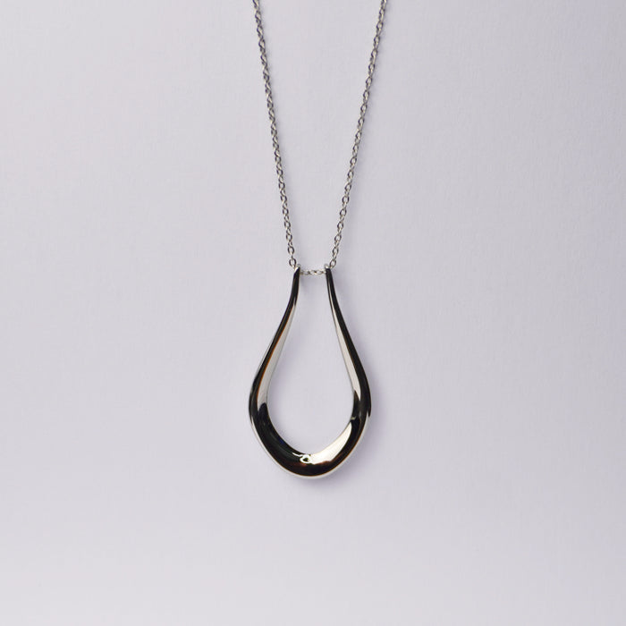 The Abalone ring holder necklace in gold with an adjustable chain