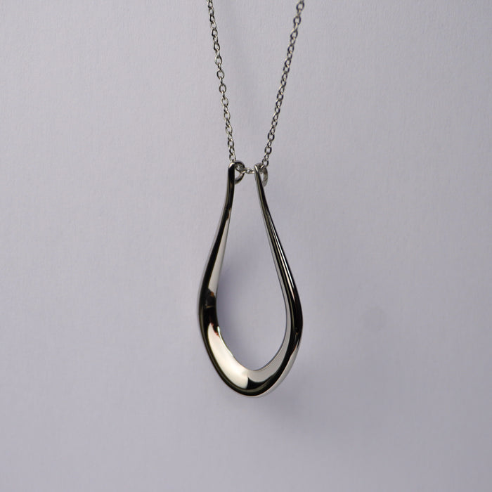 The Abalone ring holder necklace in silver, teardrop pendant on a fine chain