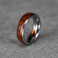 The Acacia, a 6mm round-profile tungsten band with a Koa wood inlay
