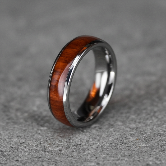 The Acacia, a 6mm round-profile tungsten band with a Koa wood inlay