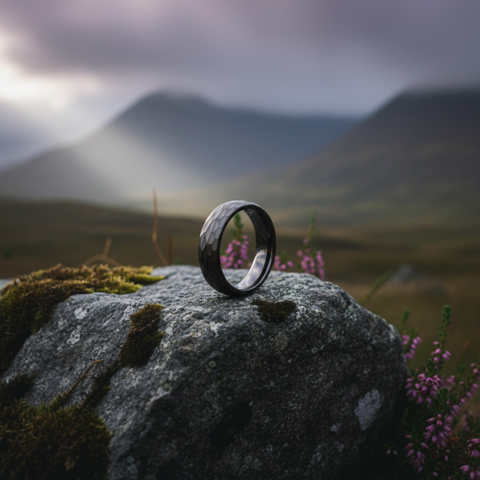 The Anvil 6mm gunmetal ring on a textured rock backdrop