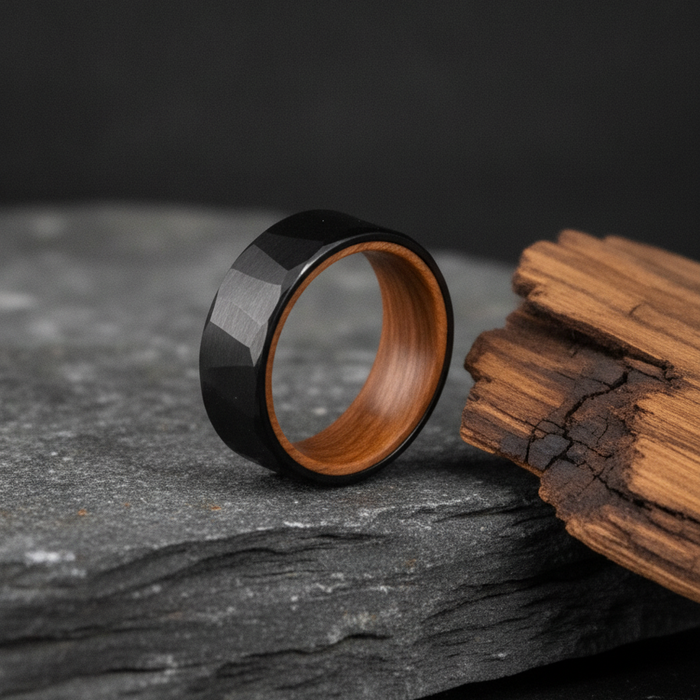 The Barrelhouse, an 8mm faceted black tungsten band with a whisky barrel oak interior