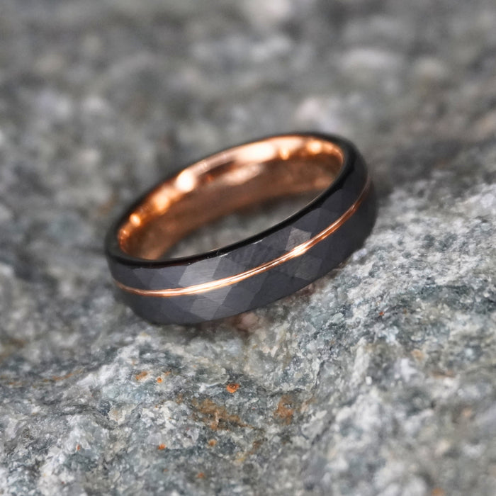Black tungsten wedding band with rose gold accents, 6mm width, by Forge and Lumber.