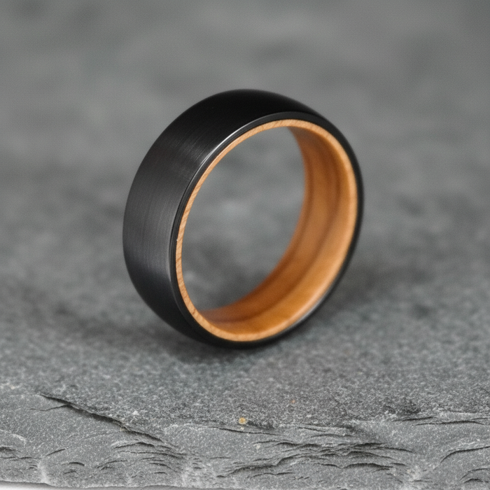The Campbell, an 8mm black plated tungsten band with a whisky barrel oak interior