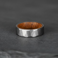 The Cask, a 6mm faceted tungsten band with a whisky barrel oak interior