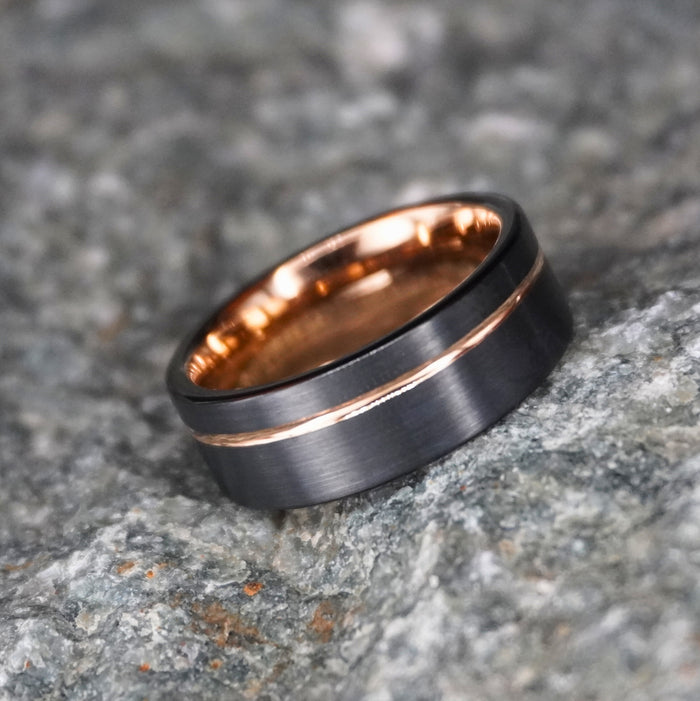 The Farrier 8mm black and gold band shown at an angle