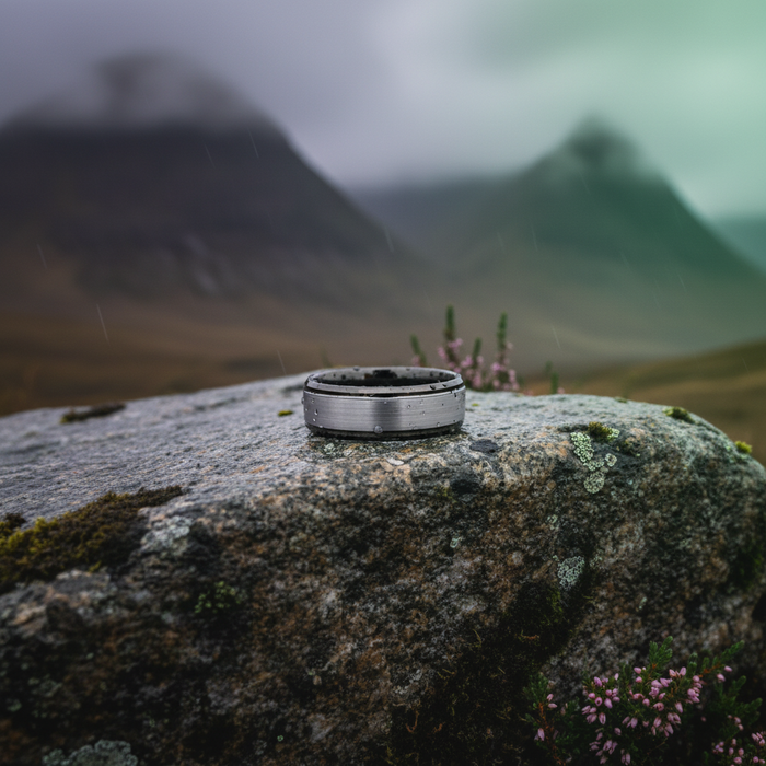 The Fortress 8mm bevelled ring against a misty mountain backdrop