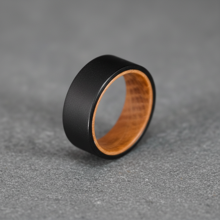 The Hebridean, an 8mm black plated tungsten band with a whisky barrel oak interior