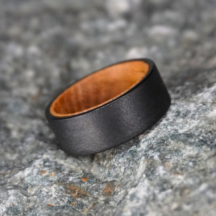 The Hebridean 8mm black tungsten ring with barrel oak interior