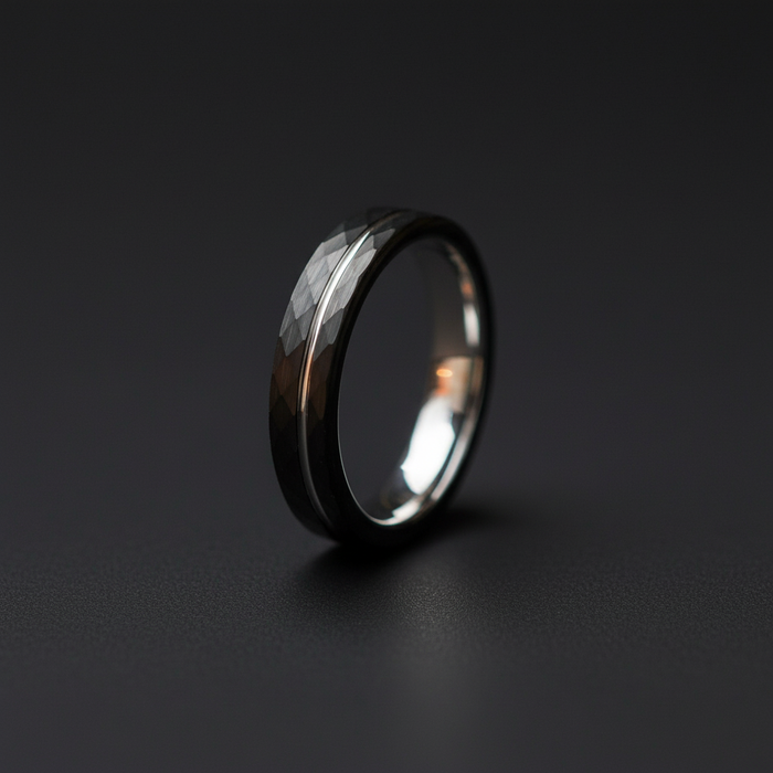 The Lode, a 4mm faceted black plated tungsten band with a bare tungsten pinstripe
