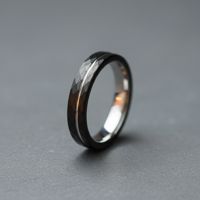The Lode 4mm tungsten ring with faceted black plating and a pale centre stripe
