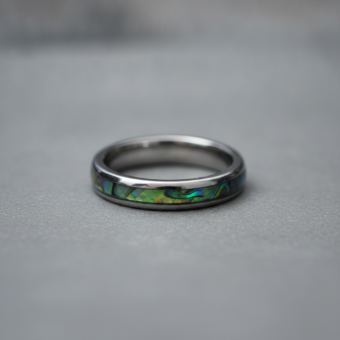 The Moana, a 4mm round-profile tungsten band with a Paua shell inlay