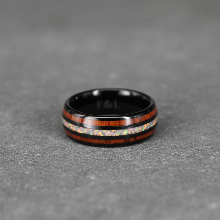 The Opallios, an 8mm black plated tungsten band with opal and Koa wood inlays