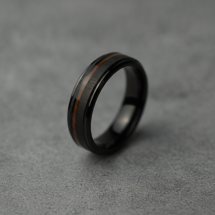 The Peat, a 6mm bevelled black plated tungsten band with a Koa wood inlay