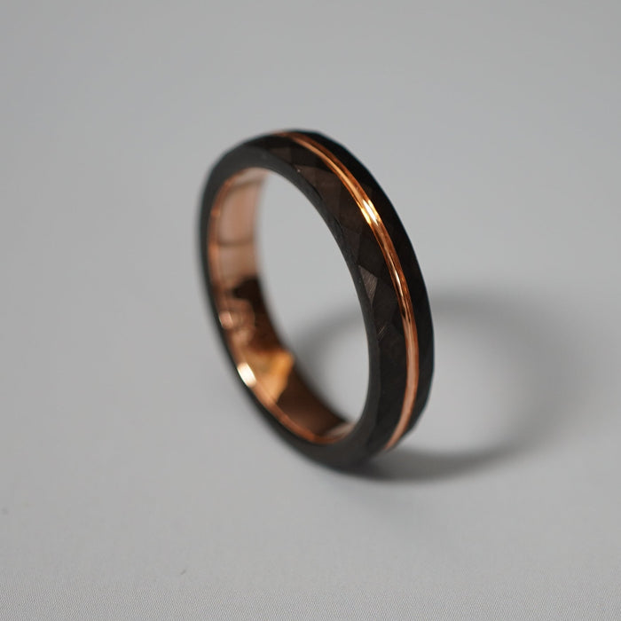 The Tana 4mm black and rose gold band shown close up