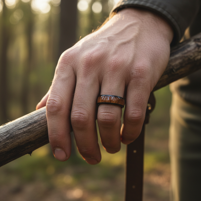 The Ukulele ring worn on a hand outdoors