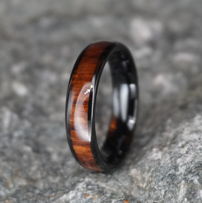 The Warrior 6mm black comfort-fit ring with Koa wood inlay