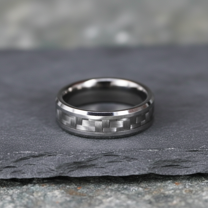 The Weaver, a 6mm bevelled tungsten band with a carbon fibre inlay