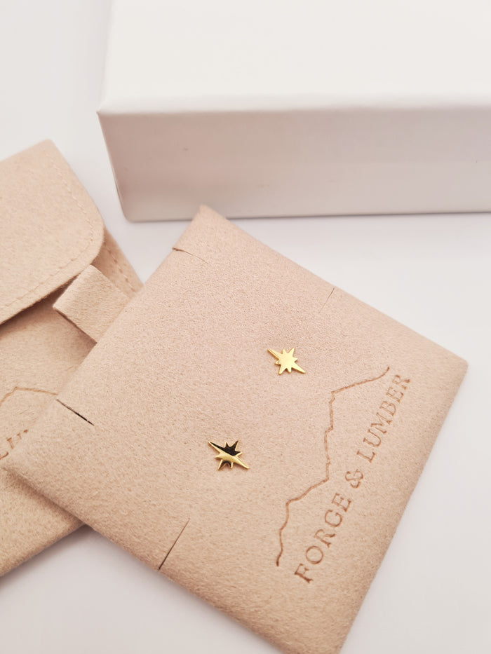 18k gold-plated star stud earrings by Forge and Lumber, hypoallergenic and perfect for everyday wear.