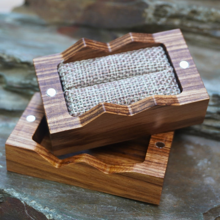 Handcrafted wooden ring box with burlap lining by Forge & Lumber, featuring a unique wavy design.